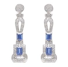 Exceptional and Edwardian!  These platinum earrings were originally a watch bracelet which has been transformed into a fabulous pair of earrings that are very elegant.  The earrings comprise 72 round diamonds which are approx. .80 Cts. TWT.  The 4 emerald cut sapphires total approx. 1.35 Cts. The earrings have a swing element to them below the round diamond top. They are striking and very comfortable.  1.25 inches long. Post Backs. Elegant Blue Platinum Earrings, Timeless Hallmarked Diamond Earrings For Formal Occasions, Luxury Pave Setting Earrings For Formal Events, Luxury Pave Set Earrings For Formal Occasions, Luxury Hand-set Diamond Earrings For Formal Occasions, Luxury Hand Set Diamond Earrings For Formal Occasions, Elegant Platinum Earrings With Pave Setting, Formal Platinum Earrings With Pave Setting, Timeless Formal Diamond Earrings