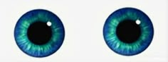 an eye with blue and green colored irises