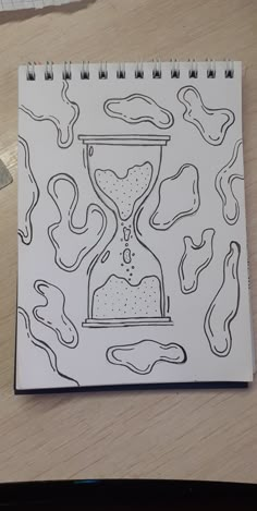 a drawing of an hourglass on top of a table