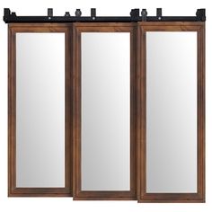 three doors with mirrors on each side