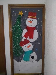 the door is decorated with two snowmen and a christmas tree