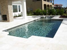 an empty pool in the middle of a house