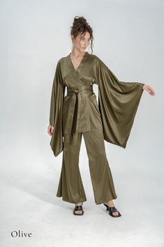 Indulge in the opulence of silk kimono pajamas, a sophisticated upgrade to your casual at-home attire. Drawing inspiration from the exquisite designs of traditional Japanese kimonos, our collection offers a fusion of comfort and elegance. Immerse yourself in the enduring allure of authentic Japanese traditions with our luxurious silk kimono line. ✂ About us: ♥ Est. 2017 ♥ Based in Lincolnshire, UK ♥ Handmade in Europe ♥ Small family run brand ♥ Handmade in Europe ♥ Sustainable and ethical production ♥ We support local craftsmanship ♥ Sizes for all body types ✂ About PJs: * Obi tie belt * Long wide kimono sleeves * Hidden side kimono pockets * Inside loops * High-waisted trousers *Trouser pockets * Silky Satin ✂ Shipping: * Fast UK delivery in 1 - 2 days * We ship worldwide! * Returns accep Luxury Pjs, Pyjamas Silk, Embroidered Pajamas, Kimono Pajamas, Robe Silk, Narrow Waist, Silk Dressing Gown, Traditional Japanese Kimono, Satin Kimono