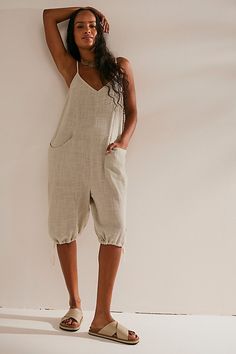 So beachy and effortless, this bloomer-inspired romper from our free-est collection is the perfect throw-on-and-go staple. **Fit:** Billowy, shapeless silhouette **Features:** V-neckline, tie shoulder straps, below-the-knee cinch crop, woven fabrication **Why We ❤ It:** Easily thrown over your swimsuit or layered with a cozy cardi, this romper has endless ways to wear. | Down For The Day Romper by free-est at Free People in Grey, Size: XS Business Attire Women, Free People Style, Playsuit, Spring Outfit, Boho Outfits, Beach Outfit, Summer Collection, Shoulder Straps, Spring Fashion