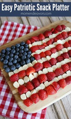 an american flag made out of strawberries and blueberries on a cutting board with the words easy patriotic snack platter