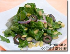 a white plate topped with greens and mushrooms