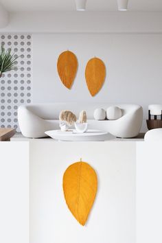 The humble Leaves, from the simple shapes of some to the complex web of veins in others – have captivated artists and designers, for centuries. The simple leaf has transformed into enduring beauty throughout the periods of history. Hanging Leaf, Large Wall Hanging