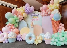 an ice cream themed party with balloons and doughnuts