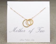 "Mother Of Two Infinity Necklace ~ With 3 delicate and simple infinity circles that represent your beautiful family. * Available in gold, rose gold or 100% sterling silver - Dainty 24k gold vermeil or sterling silver circles measure 15mm and 12mm - Necklace is made with a shimmery 14k gold fill, rose gold fill or sterling silver chain and clasp - Chain length shown on model is 18\"- Pendants are in addition to the chain length - Infinities have a tiny stamp of authenticity of sterling or 24k gol Glass Palace, Jewish Star Necklace, Tiny Necklace, Mother Of Two, Diamond Bar Necklace, Diamond Initial Necklace, Luxurious Fashion, Necklace For Mom, Infinity Jewelry