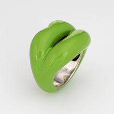 This is part of Chairish’s Costume Jewelry assortment.  Stylish pre-owned Solange Azagury Partridge ring crafted in sterling silver.   The ''hotlips'' ring by Solange is rendered in green enamel. The low rise ring (6mm - 0.23 inches) sits comfortably on the finger. The ring retailed for $1,650.   The ring is in very good condition and was recently professionally cleaned and polished.  Particulars:  Weight: 11.8 grammes  Stones:  Green enamel (in excellent condition and free of cracks or crisps). Green Enamel Ring With Polished Finish For Anniversary, Slug Rings, Lips Ring, Hot Lips, Lip Ring, Ring Crafts, Partridge, Green Enamel, Late 20th Century