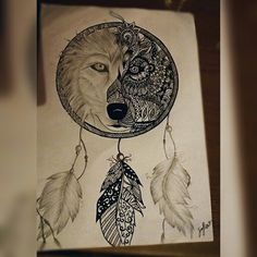 a drawing of a wolf and dream catcher