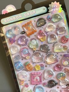 an assortment of various shaped buttons in a package