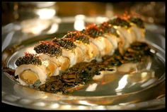 a silver plate topped with lots of food