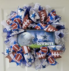 the wreath is decorated with footballs and stars