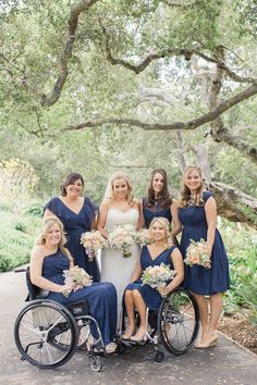 the bride and her bridesmaids are posing for a photo in their wheelchairs