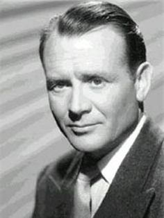 a black and white photo of a man in a suit