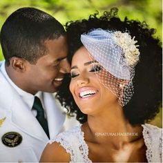 a bride and groom smile at each other