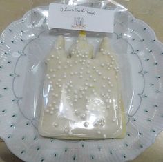 a plastic bag with pearls on it sitting on a plate