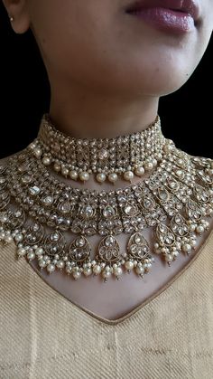 This is a beautiful Choker that comes with a set of earrings and maangtika. Can be worn on any outfit or for a bridal look as its a complete set. The double layered set is gorgeous and versatile to be worn for any type of look. Bollywood Chandbali Bridal Accessories For Wedding, Kundan Bridal Accessories With Tilla For Marriage, Silver Bollywood Bridal Necklace For Marriage, Kundan Bridal Accessories For Diwali Wedding, Silver Kundan Necklace For Wedding Bollywood Style, Bollywood Kundan Bridal Accessories For Wedding, Kundan Tilla Bridal Earrings For Wedding, Bollywood Kundan Necklace For Marriage With Intricate Design, Silver Chandbali Kundan Necklace For Marriage