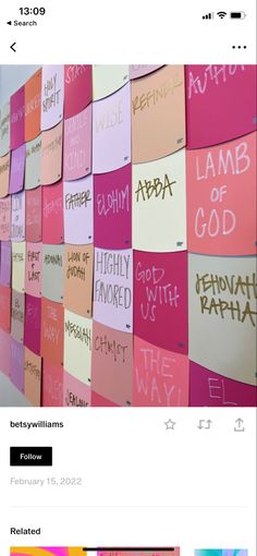 a wall covered in pink and orange sticky notes with words written on them that read lamb of god