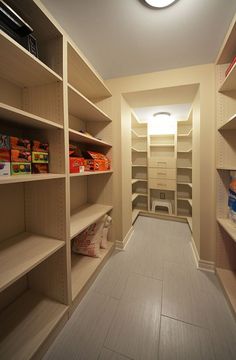 an empty walk - in closet with shelves and other items on the shelves for storage