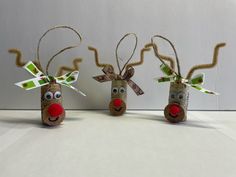 three reindeer made out of toilet paper and twine