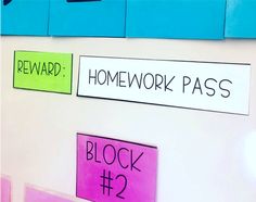 several pieces of paper taped to the wall with words on them that read homework pass and block 2