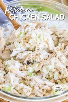 chicken salad in a glass bowl with a wooden spoon and title text reads rotissene chicken salad