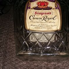 a bottle of crown royal sitting on top of a table