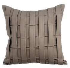 a gray pillow with braiding on the front and back side, against a white background