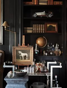 a room filled with lots of books and antiques