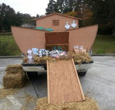 a car is loaded with hay and stuffed animals