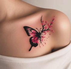 a woman's shoulder with a pink butterfly tattoo on the left side of her chest