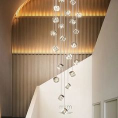 a modern chandelier hanging from the ceiling