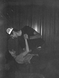 black and white photograph of two people holding each other