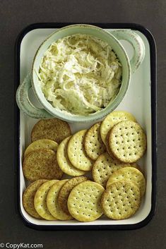 crackers and cole slaw in a container with a bowl of coleslaw