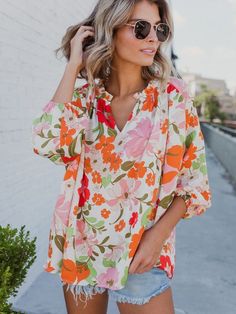 Orange Blooming Flowers Frill Trim Puff Sleeve Blouse Description: Feel charming and attention-getting with this floral blouse. Features a frilled collar with split v cut and 3/4 length puff sleeves. Relaxed fit style for comfort and effortless style. Stylish floral pattern with lightweight 100% Polyester fabric. Suitable for spring, summer, and fall seasons. Available in different sizes to choose from. Perfect for daily wear, vacation, or casual outings. Wholesale this trendy piece for the late Frilled Collar, Puff Sleeve Blouse, Fall Fashion Trends, Blooming Flowers, V Cuts, Fit Style, Floral Blouse, Puff Sleeves, No Frills