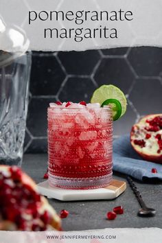 the pomegranate margarita is garnished with lime