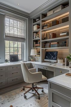 a home office with built - in shelving, desk and computer chair is shown