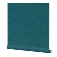 a teal colored wallpaper with a plain pattern on the top and bottom half