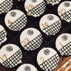 cupcakes decorated with white and black icing are arranged in a grid pattern