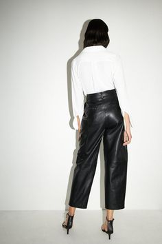 Crafted from real leather for a luxurious look and feel
Barrel leg silhouette creates a modern, relaxed fit
Sleek leather construction exudes an edgy, confident vibe
Zip fly front for a clean, tailored finish
Versatile design suitable for casual and smart-casual occasions
Embrace a bold, fashion-forward aesthetic with these real leather barrel leg trousers. The leather construction radiates a confident, edgy appeal, while the relaxed barrel leg silhouette offers a contemporary twist on classic tailoring. Pair them with a crisp white shirt and heeled sandals for a chic, casual ensemble, or elevate the look with a silk camisole and blazer for smart-casual events. These versatile trousers are a must-have for the modern, fashion-conscious woman seeking a touch of luxury in her wardrobe. Classic Tailoring, Lace Skater Dress, Crisp White Shirt, Silk Camisole, Chic Casual, Swimwear Sale, Going Out Dresses, Denim Outfit, Petite Dresses