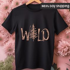 For Custom Shirt: https://www.etsy.com/listing/1827528837 For Custom Tote Bag: https://www.etsy.com/listing/1810372730 Wild Shirt, Wild Tree Shirt, Nature Outdoor Adventure T-Shirt, Camping Shirt, Camp Lover Shirt, Nature Shirt, Adventure Shirt, Travel Shirt, Gifts For Traveler How to place an order: 1-Swipe to all of the pictures. 2-Select style and size from drop down menus (t-shirt, sweatshirt or tote-bag) 3-Select colors from drop down menus. 4-Select quantity. 5-Add to Cart For every single Short Sleeve Tops With Text Print For Adventure, Black Short Sleeve Top For Camping, Black Cotton T-shirt For Adventure, Black Cotton Tops For Camping, Black Cotton Top For Camping, Black Short Sleeve Adventure Shirt, Black Short Sleeve Shirt For Adventure, Wild Tree, Travel Shirt