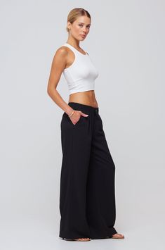 Low rise trouser Button and zipper fly closure 96% Polyester, 4% Spandex Model Measurements: Height: 5'8, Bust: 32B, Waist: 25", Hips: 35" Model is wearing a size XS Made in Los Angeles The Malcolm Trousers, crafted in a sleek and modern low rise style. Complete with a convenient button and zipper fly closure, these trousers offer both functionality and style. Elevate your wardrobe with these versatile and timeless trousers. Athleisure Fitted Wide-leg Pants, Fitted Wide-leg Athleisure Pants, Athleisure Wide-leg Workwear Bottoms, Athleisure Wide-leg Workwear Pants, Athleisure Wide-leg Pants For Workwear, Casual Wide Leg Pants With Minimal Stretch, Casual Mid-rise Pants, Athleisure Wide Leg Pants For Workwear, Mid-rise Pants With Minimal Stretch