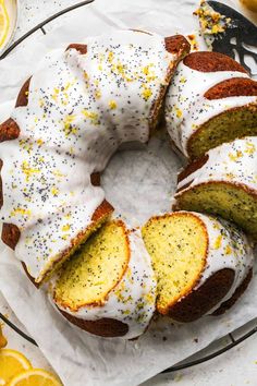 a lemon bunt cake with white frosting and sprinkles