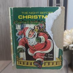 the night before christmas book sitting on a table