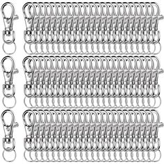 a set of metal hooks and chains on a white background