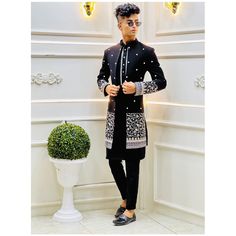 Traditional Black Sherwani For Party, Black Sherwani For Party And Festivals, Black Long Traditional Wear For Festive Occasions, Black Sherwani For Diwali Party, Black Traditional Drape Sherwani For Party, Black Sherwani With Dabka Work For Party, Black Sherwani For Party With Traditional Drape, Black Sherwani With Resham Embroidery For Party, Black Kurta For Wedding And Festivals