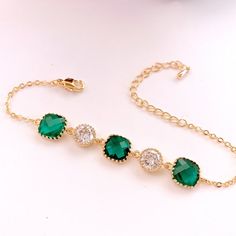 #jewelry #bracelets #chainlinkbracelets #dropearrings #dangleearrings #weddingearrings #bridesmaidearrings #bridalearrings #bridesmaidgift #studearrings #emeraldearrings #goldearrings #christmasearrings #jewerly #lalacrystal #gift for her Gold Plated Wedding Bracelets, Elegant Green Bracelets For Wedding, Elegant Green Wedding Bracelets, Elegant Gold Plated Bracelets For May Birthstone, Cubic Zirconia Bracelet For May Birthstone, Green Crystal Bracelet For Weddings, Elegant Gold Crystal Bracelet As Bridesmaid Gift, Elegant Green Crystal Bracelets, Green Crystal Wedding Bracelet