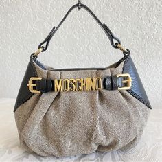 Leather And Fabric Gold Hardware Come With Adjustable Replacement Chain To Wear As Shoulder Bag Or Crossbody Bag Excellent Condition . No Defects Authentic No Trade 44# Chic Beige Shoulder Bag With Logo Hardware, Moschino Belt, Moschino Bags, Moschino, Gold Hardware, Mini Bag, Crossbody Bag, White And Black, Bag Lady